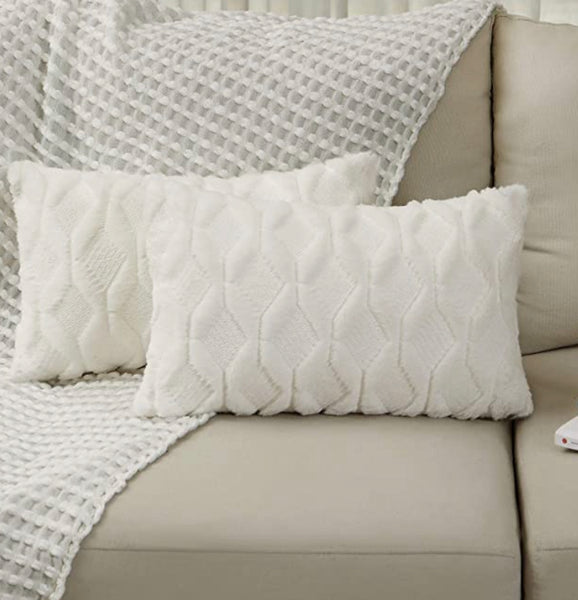 A 12x20 WHITE TEXTURED PILLOW