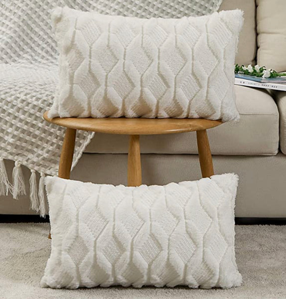 A 12x20 WHITE TEXTURED PILLOW
